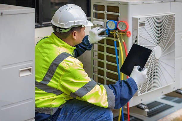 Professional Heat Pump Repair technician working in Bon Aqua, TN